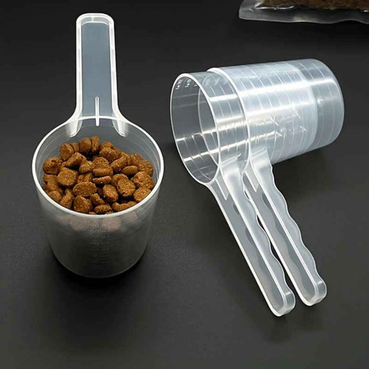 Cuillère de nourriture transparente pour chiens et chats avec marques de mesure. Plastique durable, manche ergonomique, facile à nettoyer. Idéale pour aliments secs, humides, compléments et lait en poudre